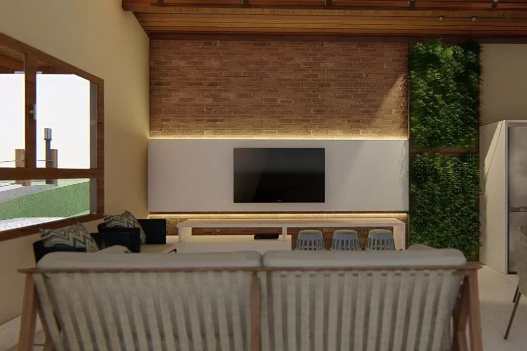 Vista geral da área de lazer com varanda e piscina ao fundo